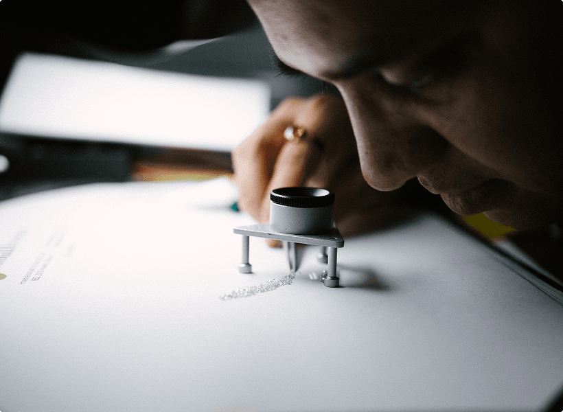 Hand holding a rough diamond