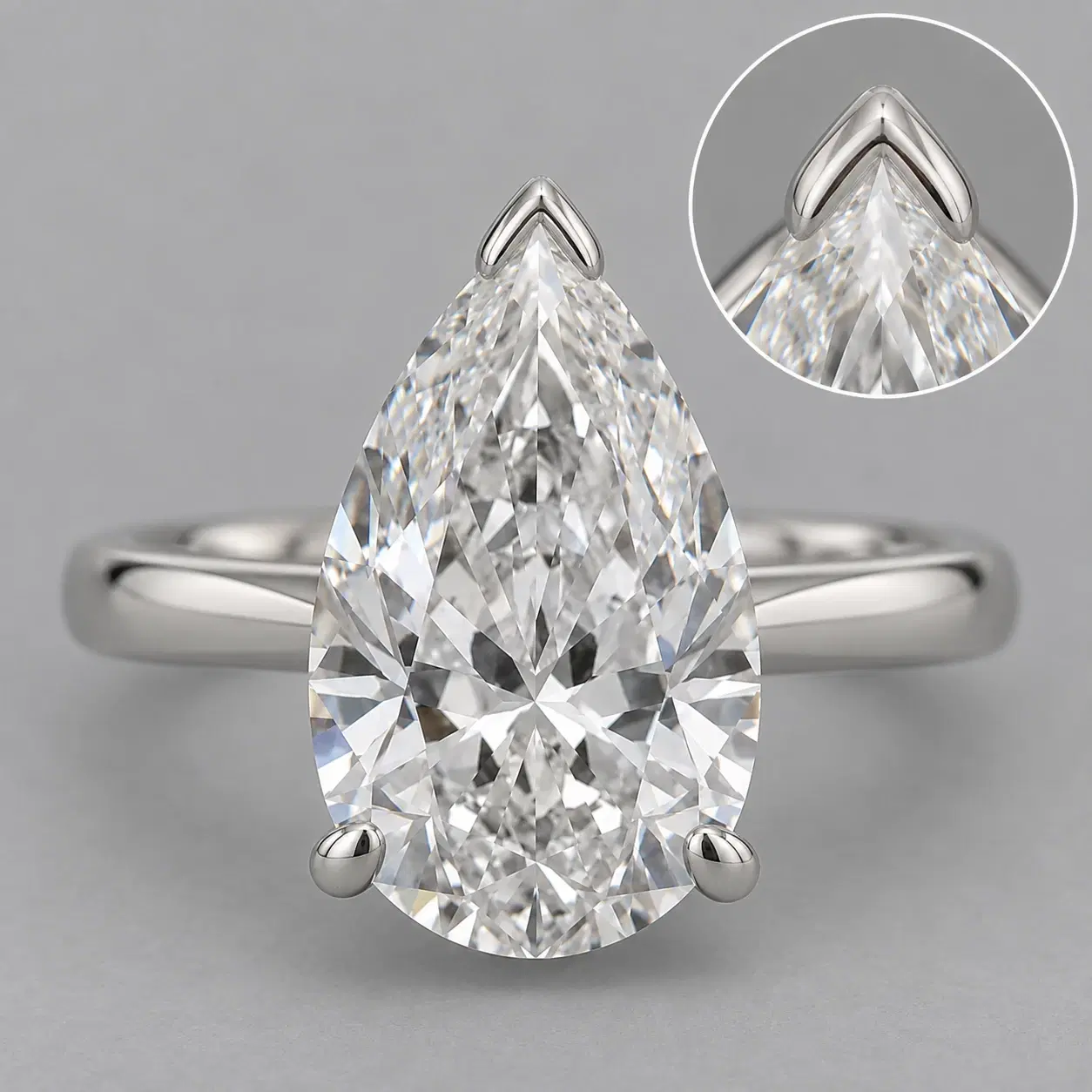 V-shaped prong protecting the pointed tip of a pear diamond