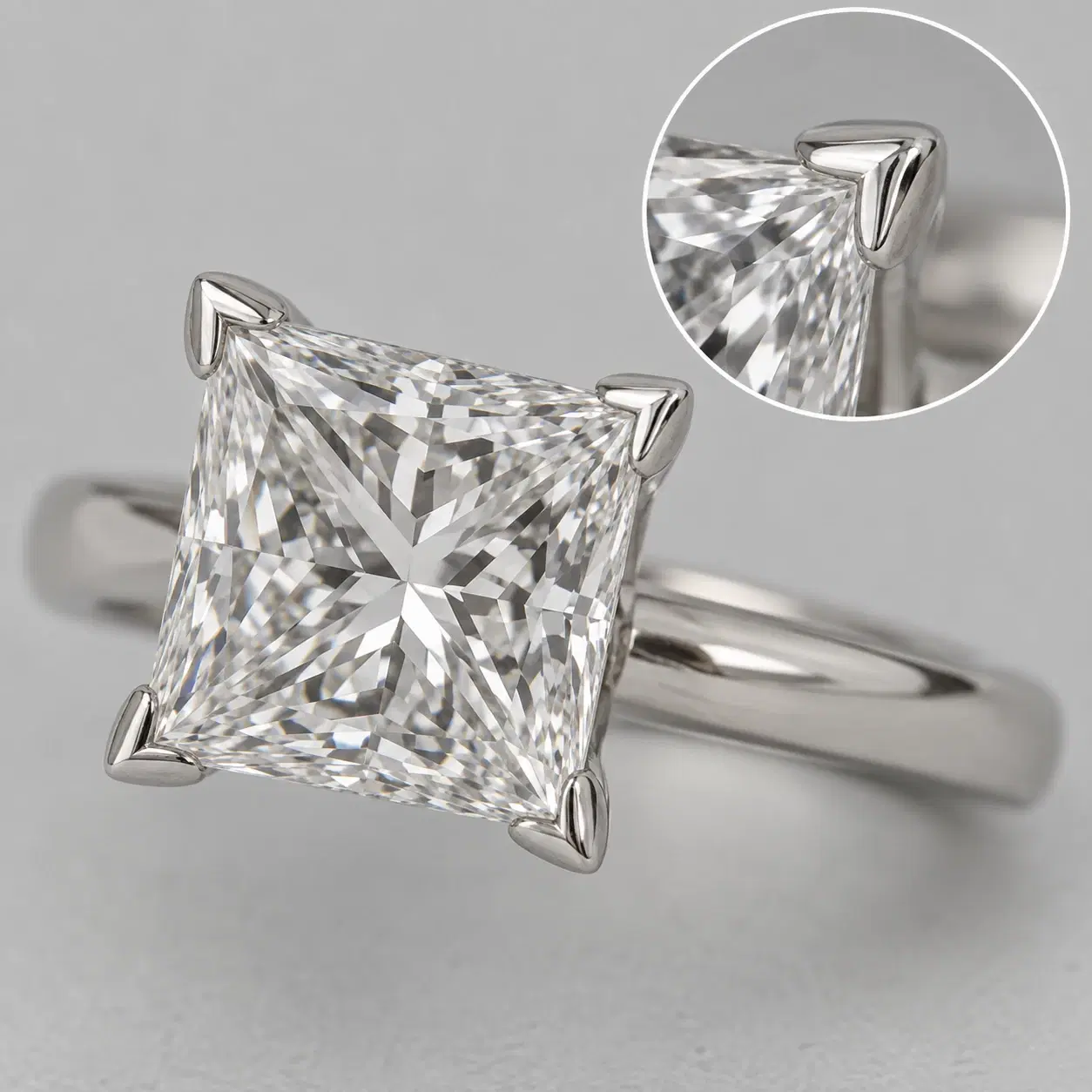 V-shaped prong covering the pointed corner of a Princess diamond